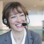 Laughing woman with headset